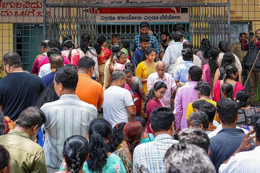 Several Bengaluru residents that News18 spoke to said they were hoping that they would get better roads, a regular water supply, and an improved public transport system to help ease travel. (Photo: PTI)