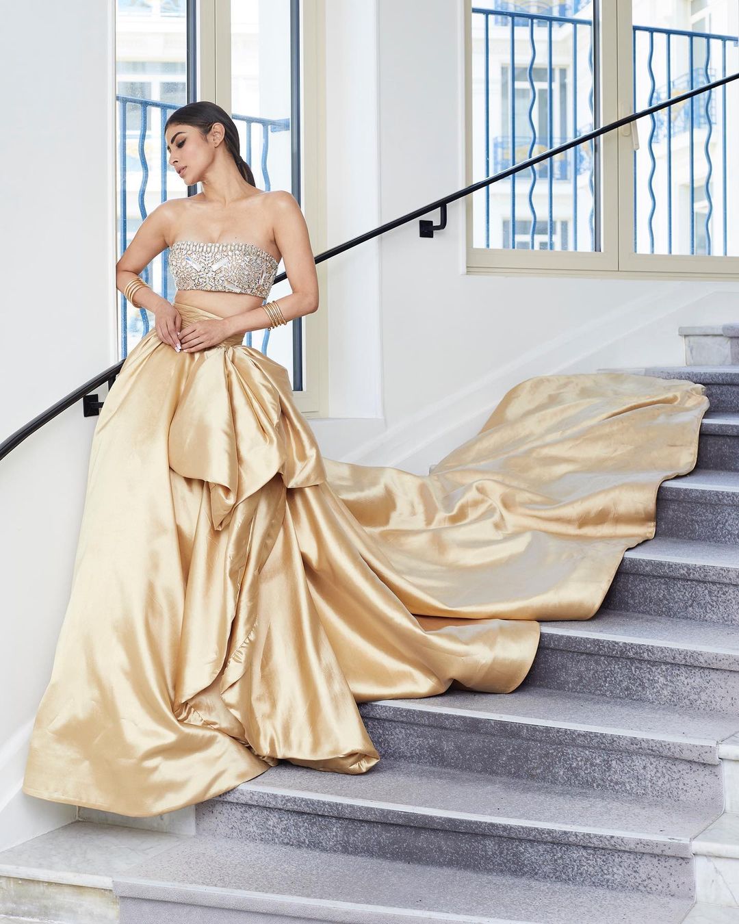 mouni roy gold dress Cannes 2023: Makes Grand Red Carpet Debut In Princess-style Ruffled Gown, See Pics Lehenga choli