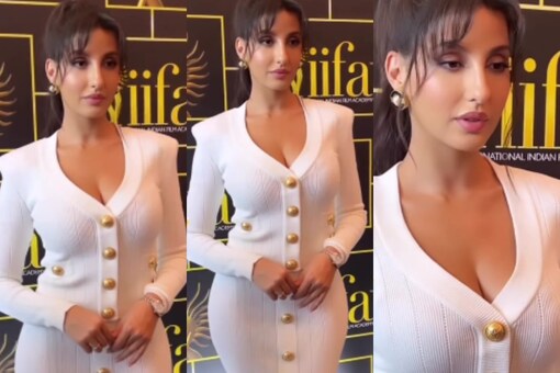 Bollywood actress Nora Fatehi oozes hotness in a skintight busty dress at IIFA.