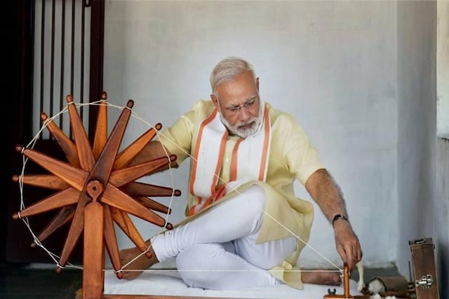 File photo of Prime Minister Narendra Modi spinning a charkha at the Sabarmati Ashram in Gujarat. (PTI)