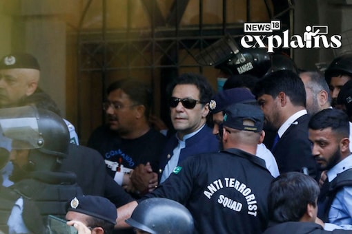 Security officers escort Pakistan's former Prime Minister Imran Khan, as he appeared in Islamabad High Court, Islamabad, Pakistan May 12, 2023. REUTERS/Akhtar Soomro 