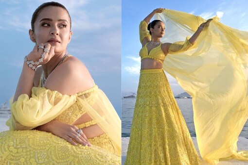 In the first photos from the 2023 Cannes Film Festival, Surveen Chawla is seen wearing a yellow lehenga. (Instagram)