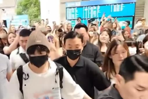Watch: BTS Star Jungkook Gets Mobbed At Airport, Tries To Protect Fan ...