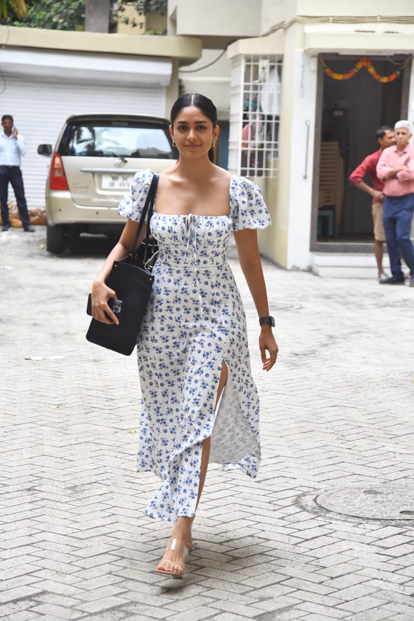  The dress had a broad shoulder cut with a plunging neckline that accentuated her collarbones. The very structure of the dress complimented Mrunal's figure and she seemed utterly comfortable in it. (Image: Viral Bhayani)