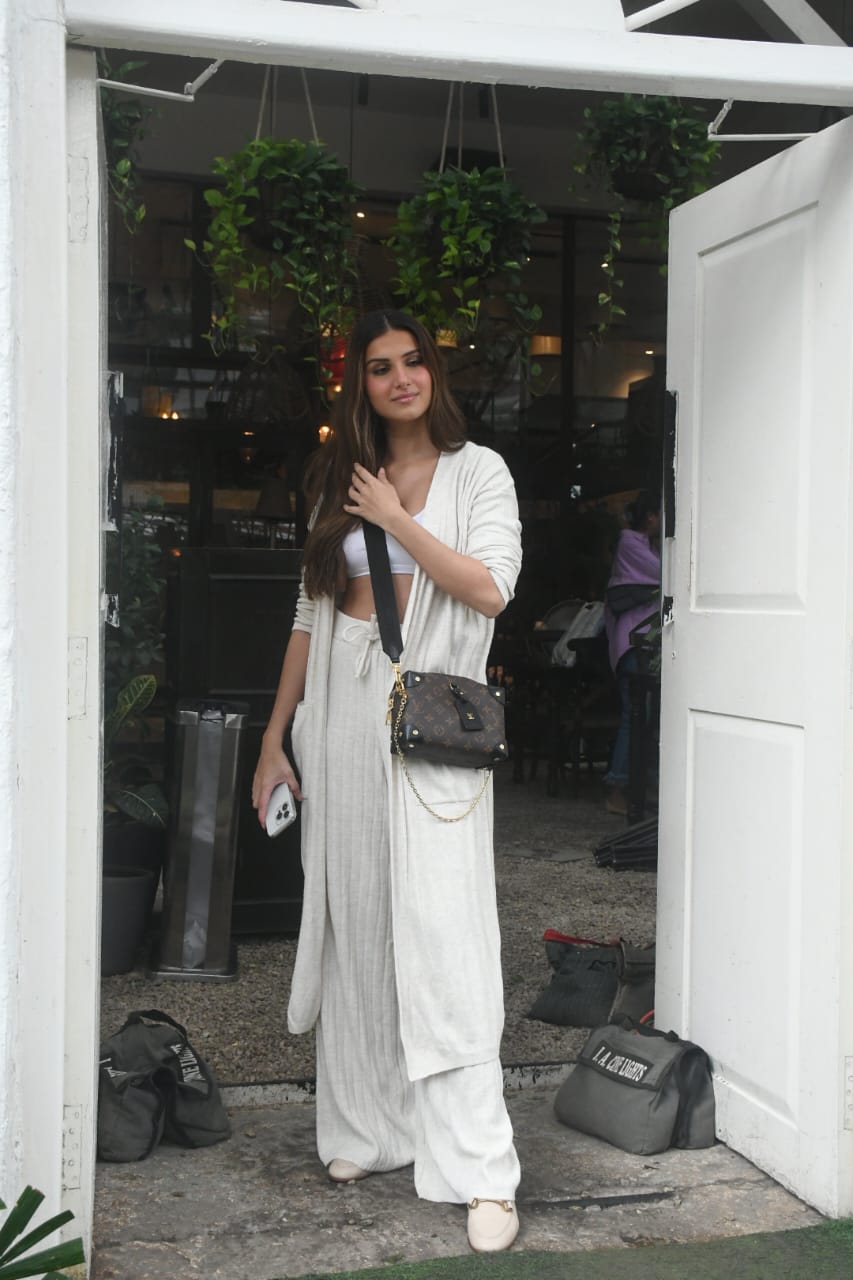  The actress accessorised her look with a Louis Vuitton sling bag and a pair of white loafer-like sandals. (Image: Viral Bhayani)