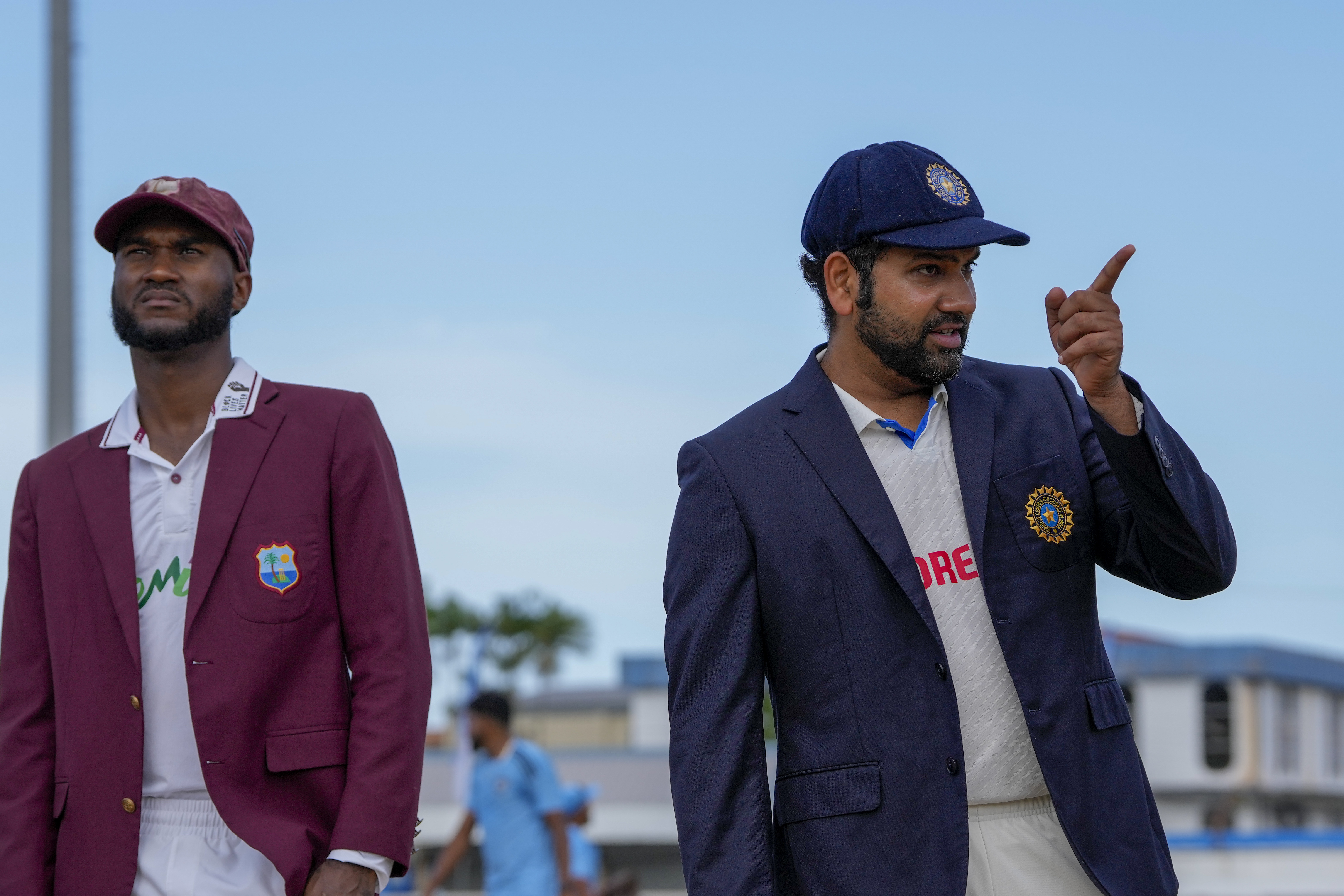 Team India captain Rohit Sharma and Kraigg Brathwaite at the toss, Brathwaite won the toss and elected to bowl first, making 2 changes to his side, while for India, Mukesh Kumar made his debut. (AP Photo) Team India captain Rohit Sharma and Kraigg Brathwaite at toss, Brathwaite won the toss and elected to bowl first, making 2 changes to his side, while for India, Mukesh Kumar made his debut. (AP Photo)