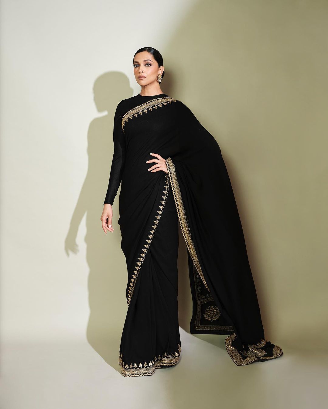 Deepika Padukone keeps it 'classic', in a black Sabyasachi saree. The choice to pair the beautiful saree with a full-sleeve black blouse and neatly tied bun makes the look classy. (Image: Instagram) Deepika Padukone keeps it 'classic', in a black Sabyasachi saree. The choice to pair the beautiful saree with a full-sleeve black blouse and neatly tied bun makes the look classy. (Image: Instagram)