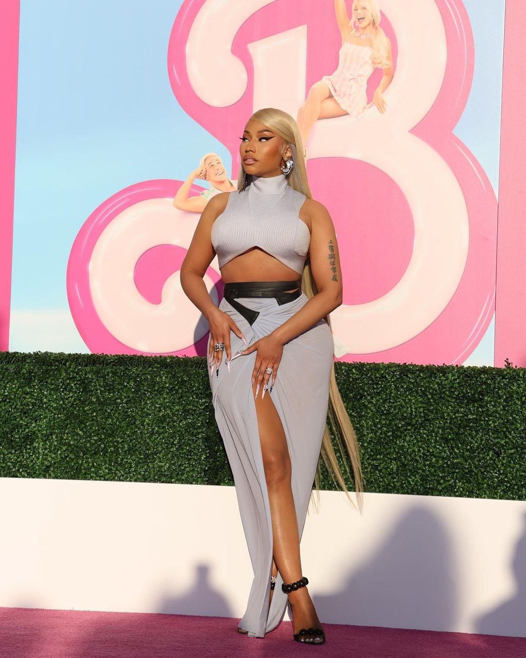Nicki Minaj is the moment! Fans appreciate her look saying that she is the real Barbie. She looks gorgeous in a grey high-neck crop top and front-slit grey skirt, with black heels and cat eye eyeliner. (Image: Instagram)