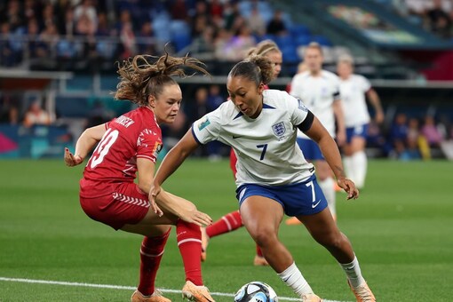 England's Lauren James competes for the ball with Denmark's Janni Thomsen during the Women's World Cup Group D soccer match between England and Denmark at Sydney Football Stadium in Sydney, Australia, Friday, July 28, 2023. (AP Photo/Sophie Ralph)
