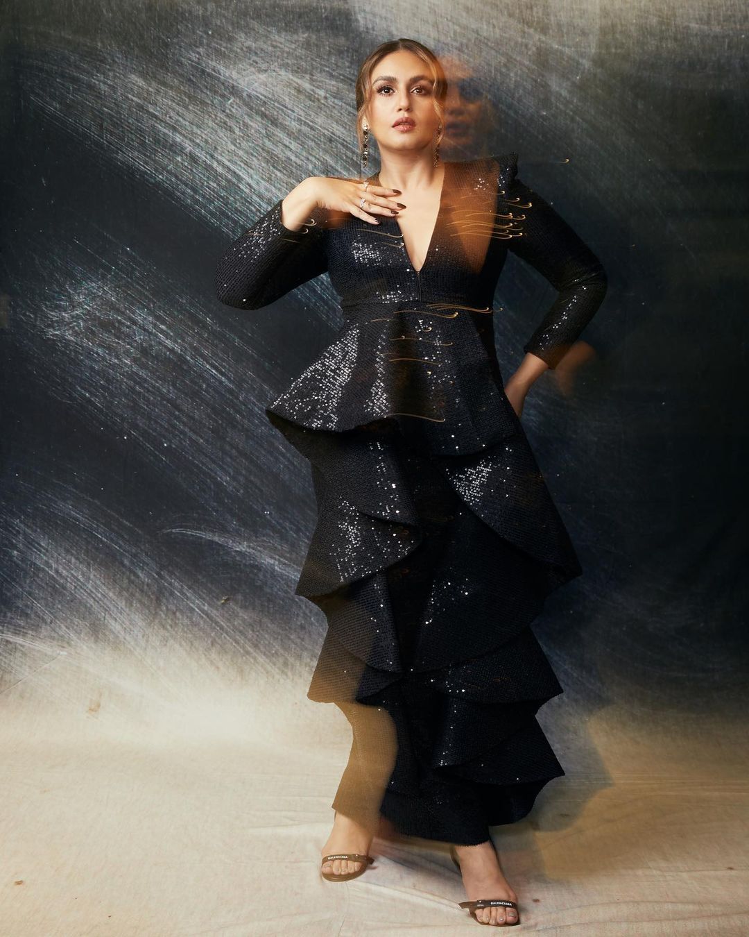 Earlier at IWMBuzz awards, Huma Qureshi stole the spotlight in a sequin-studded black gown. With a flattering deep V-neckline, and those fabulous frills to add extra touch of style, the actress owned the red carpet like a true fashion icon. (Image: Instagram)