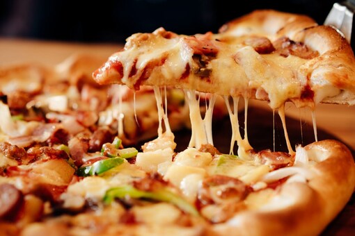 Pizzas have surely changed over the years, and we love to have anything with a dash of Indian flavours in it (Image: Shutterstock)