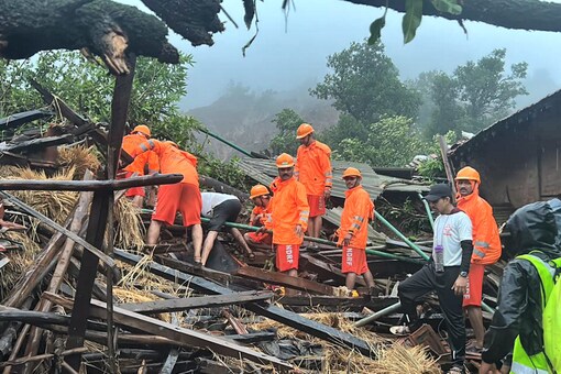 NDRF personnel carry out search and rescue operations after a landslide at Irshalwadi village of Raigad district in Maharashtra, on July 20. (Image: PTI)