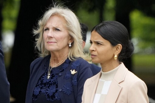 US First Lady Jill Biden and UK First Lady Akshata Murty walk to a flower wreath laying ceremony at the Cenotaph for Atomic Bomb Victims in the Peace Memorial Park in Hiroshima, Japan. (Image: Reuters)