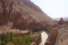 Chinese Tourists Brave Sweltering Heat to Witness the Majestic 'Flaming Mountains'