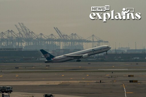 A plane departs Newark Liberty International Airport amid hazy conditions in New Jersey. (AFP)