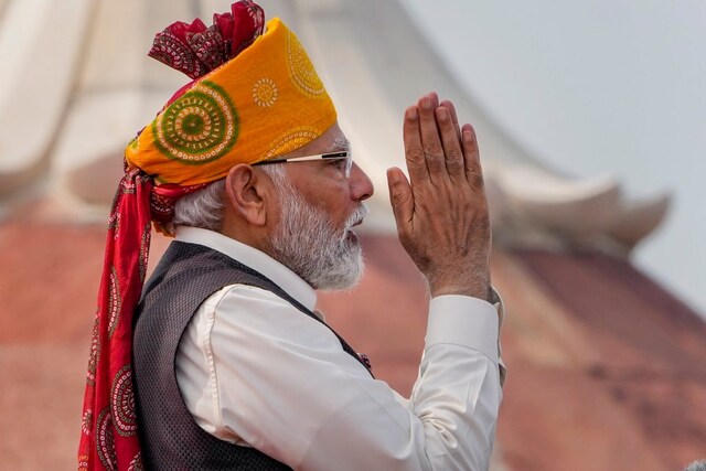 From a bright red bandhani turban from Kutch to a Rajasthani ‘safa’, Modi’s eye-catching turbans have been a highlight of his Republic Day and Independence Day appearances. (Image: PTI) 