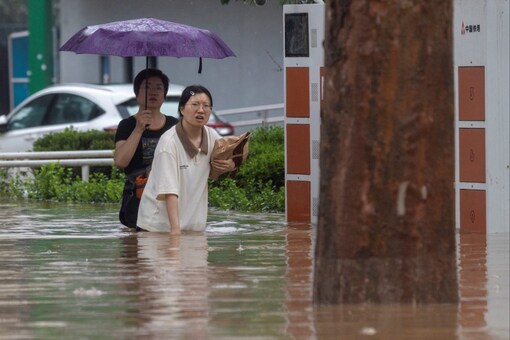 Extreme Weather Asia: Beijing Floods Claim 11 Lives, Typhoon Khanun 