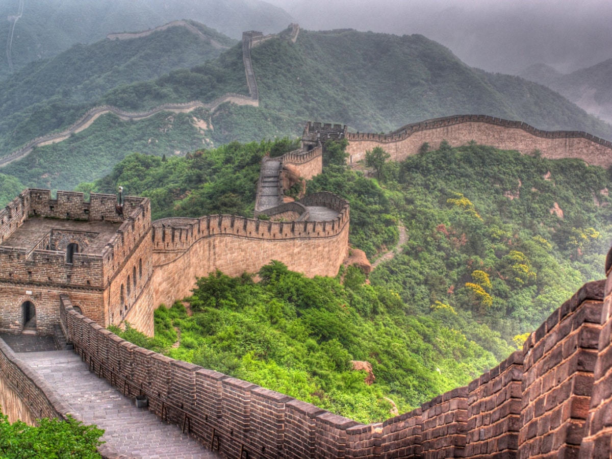 Great Wall of China damaged by workers with an excavator