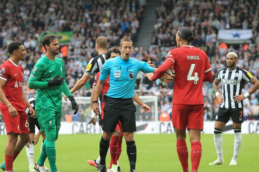 Virgil Van Dijk receiving his red card. (Credit: AFP)