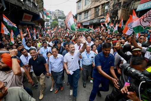 Congress leader Rahul Gandhi waves at supporters during a padyatra from Chanmari to Raj Bhawan in Aizawl, Mizoram on October 16, 2023. (PTI)