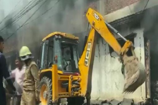 The firefighters were seen using bulldozers to bring the blaze under control.

(Image: Screengrab/ANI)