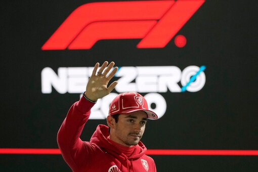 Ferrari driver Charles Leclerc, of Monaco, waves after winning the pole position during qualifications for the Formula One Las Vegas Grand Prix auto race, Saturday, Nov. 18, 2023, in Las Vegas. (AP Photo/John Locher)