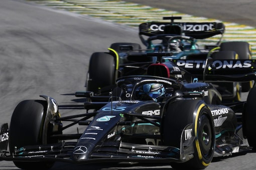 Mercedes driver George Russell of Britain, front, steers his car during the Brazilian Formula One Grand Prix at the Interlagos race track in Sao Paulo, Brazil, Sunday, Nov. 5, 2023. 