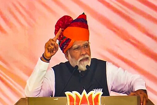 Prime Minister Narendra Modi during his address at a public meeting in Rajasthan's Churu. (Image: News18)