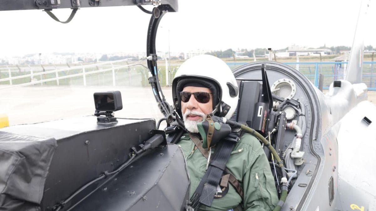 Pm narendra modi flies sortie in tejas fighter jet in bengaluru | in pictures - news18
