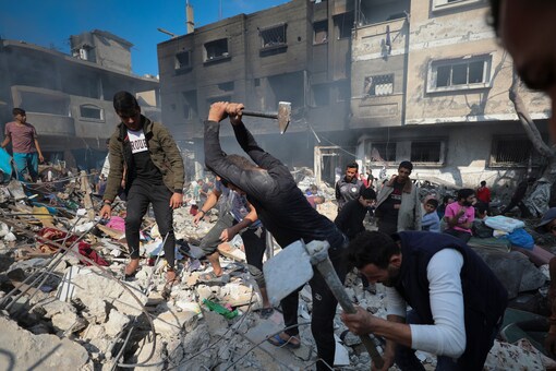 Palestinians search for survivors after an Israeli strike on the Gaza Strip in Nusseirat refugee camp, central Gaza Strip, Nov. 17, 2023. (AP File Photo)