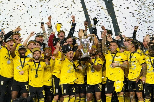 Columbus Crew players celebrate with the trophy after beating Los Angeles FC. (AP Photo)