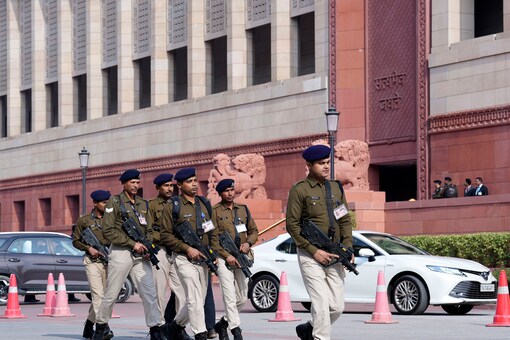 Armed security personnel patrol the Parliament House premises day after a security breach on the anniversary of the 2001 Parliament terror attack, in New Delhi on December 14, 2023. (PTI)