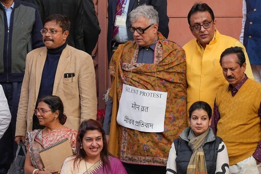 Suspended TMC MP Derek O’Brien during a silent protest outside the Parliament House during the Winter session. (Image: PTI)