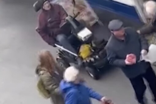 The scooter-wielding senior is seen brandishing his walking stick.  (Photo Credits: Twitter)