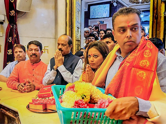 Former Union minister Milind Deora and his wife Pooja offer prayers at the Siddhivinayak Temple in Mumbai on January 14, 2024. (PTI)