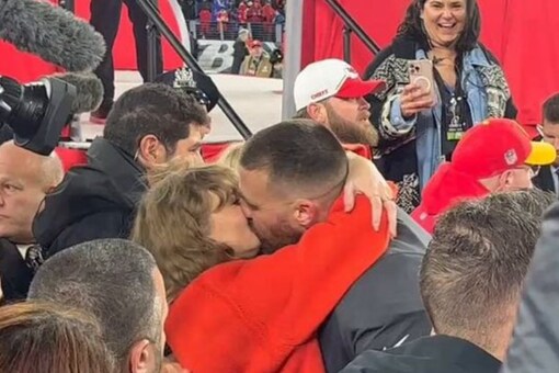 Taylor Swift and Travis Kelce kissed on the field.  (Photo Credits: X)
