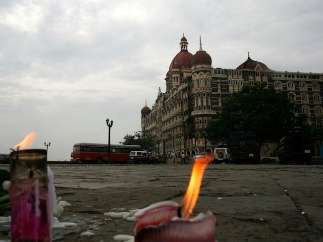 Candles placed for victims of the Mumbai attacks are seen in front of the Taj Mahal Hotel in Mumbai November 30, 2008. (Reuters File Photo)