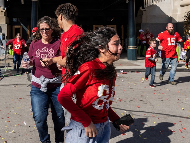 Bystanders fleeing the scene after shots were fired at the Kansas City Chiefs' Super Bowl Parade (Credit: AFP)