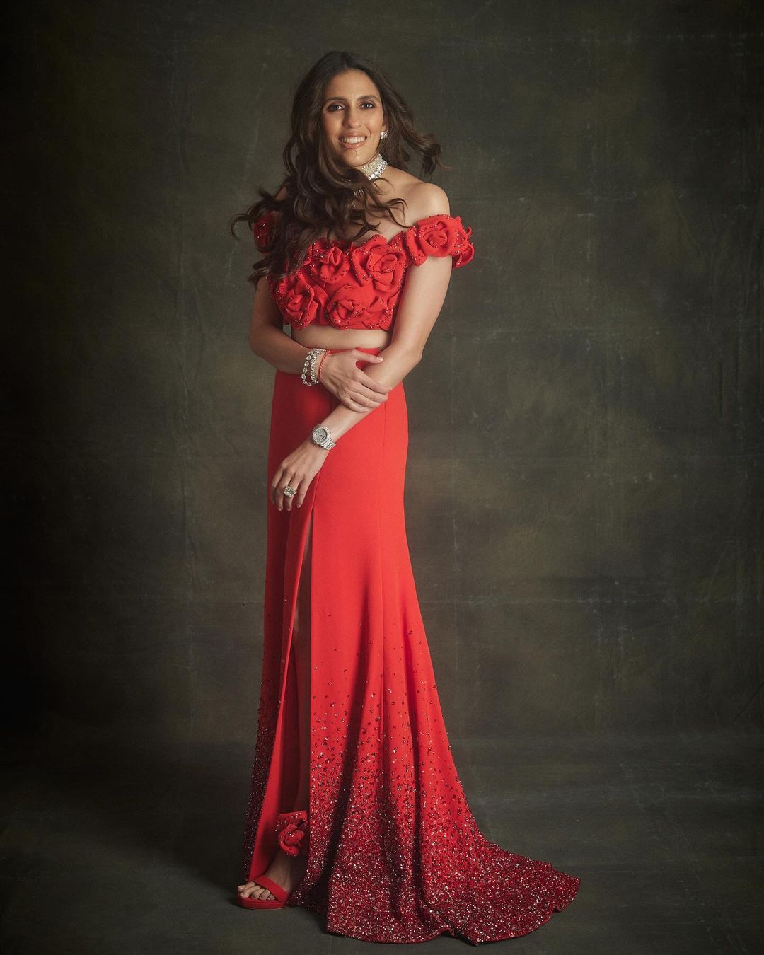  Shloka Mehta stunned in a red Valentino outfit adorned with 3D floral details and shimmer.