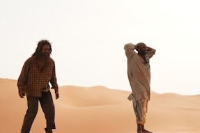 Prithviraj Sukumaran (L) and Jimmy Jean Louis (R) from the film Aadujeevitham - The Goat Life.