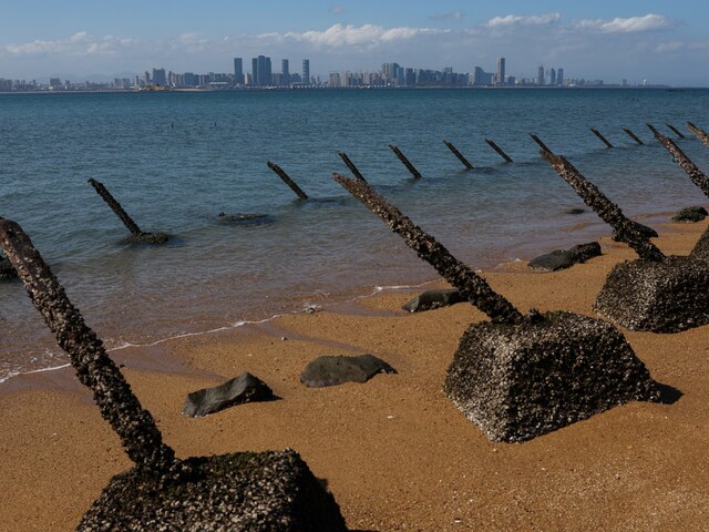 Anti-landing barricades are pictured on the beach, with China's Xiamen city in the background, in Kinmen, Taiwan February 21, 2024. (Reuters)