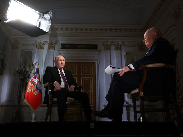 Russian President Vladimir Putin speaks with Director General of Rossiya Segodnya media group Dmitry Kiselyov during an interview in Moscow, Russia, March 12, 2024. (Sputnik/Gavriil Grigorov/Pool via Reuters)