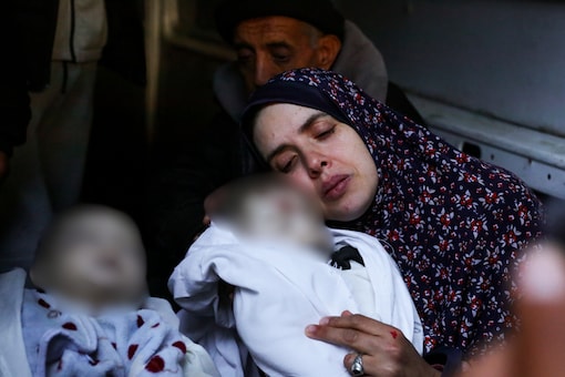 Rania Abu Anza cradles her twins, who were killed in an Israel strike on a house in Rafah, in the southern Gaza Strip, Sunday, March 3, 2024. (AP Photo)