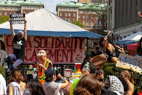 People cheer as Pro-Palestinian demonstrators march around the Gaza Solidarity Encampment in the West Lawn of Columbia University in New York City. (Image: AFP)