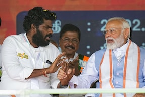 Prime Minister Narendra Modi with Tamil Nadu BJP president K Annamalai during the closing ceremony of the BJP's ‘En Mann Ek Makkal’ padyatra, near Palladam in Tirupur on February 27, 2024. (PTI)
