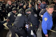 New York City Police Department officers arrest pro-Palestinian protesters outside a student-led encampment at New York University. (Image: AP Photo)
