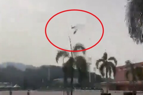 Two helicopters of the Royal Malaysian Navy collided while rehearsing for an event near Kuala Lumpur. (Image: @Megatron_ron/X)