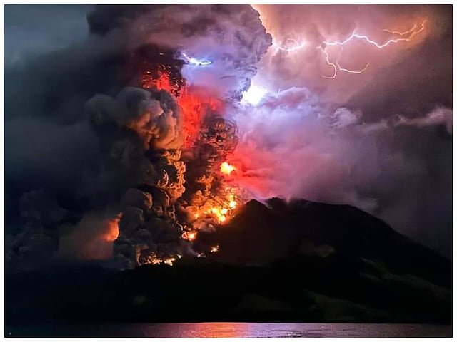  A volcano erupted several times in Indonesia's outermost region overnight on April 17, forcing hundreds of people to be evacuated after it spewed lava and a column of smoke more than a mile into the sky. (Photo by Handout / Center for Volcanology and Geological Hazard Mitigation / AFP) 