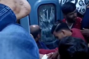 Watch: Man Breaks Glass Door After Ticketless Passengers Block His Reserved Seat