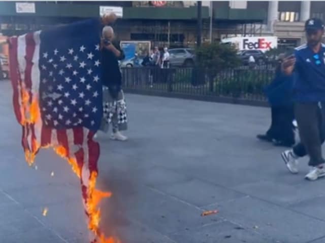 Another activist was seen burning the US flag in New York City. (Image/X@OliLondonTV)